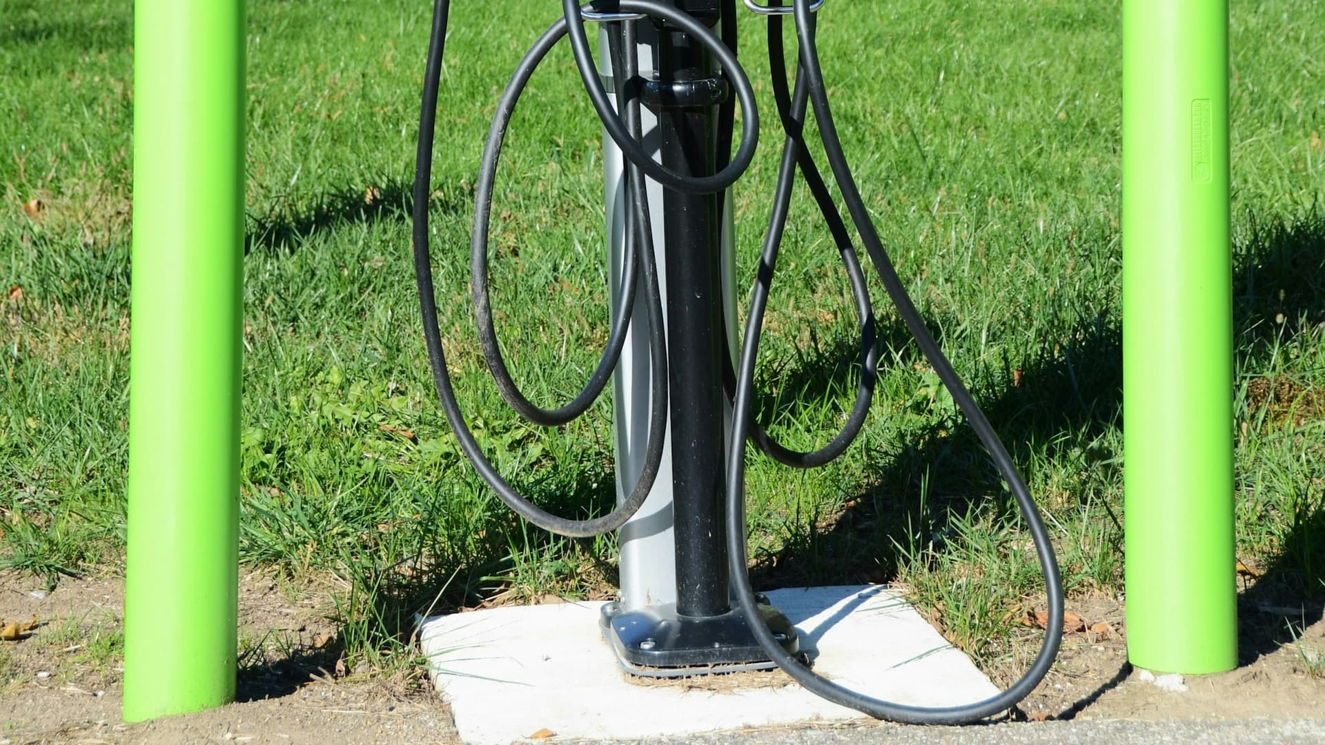 Electric vehicle charging station with cables, representing power resilience infrastructure.