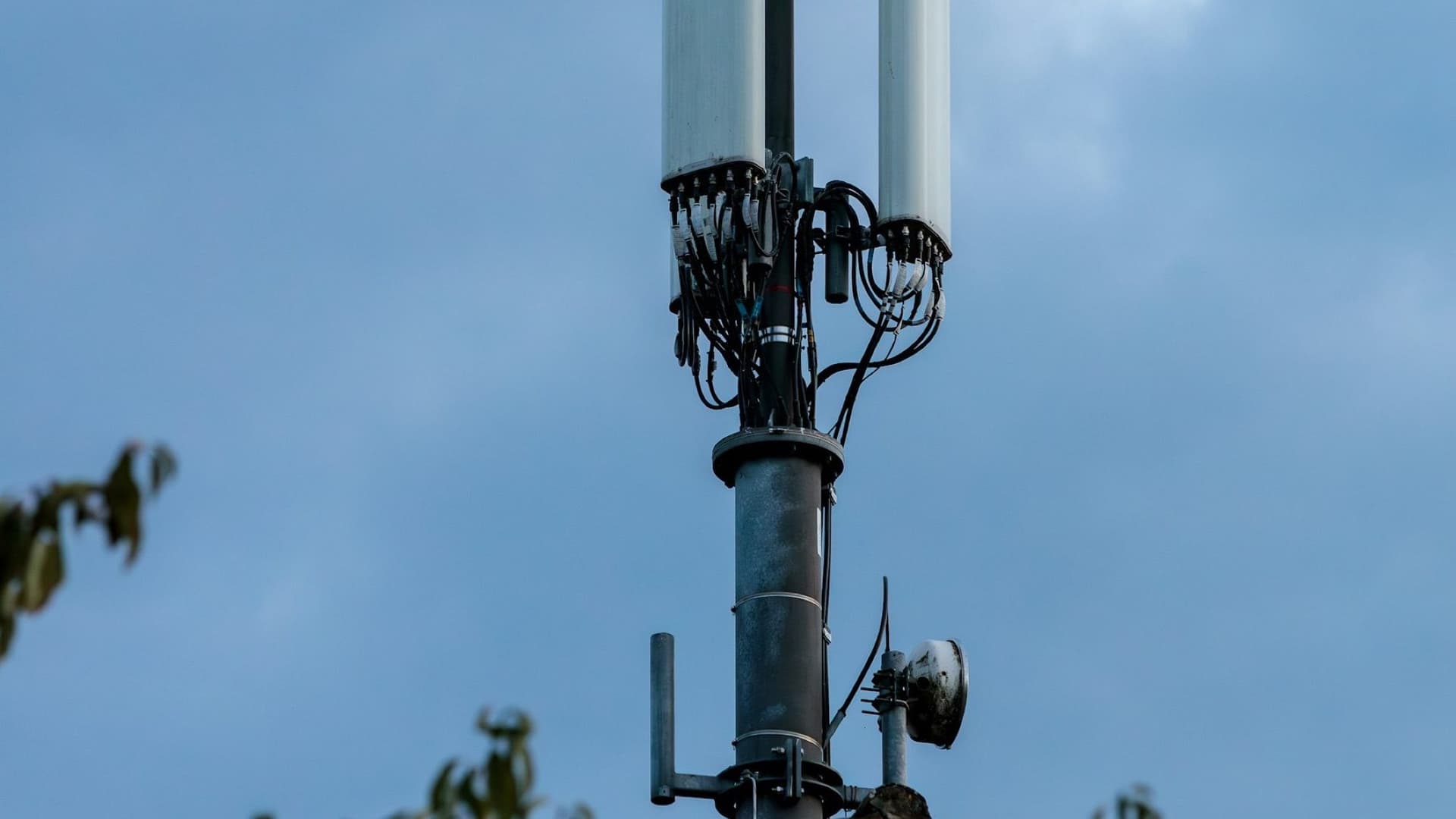 Rooftop wireless site with antennas, mounts, and sector equipment.